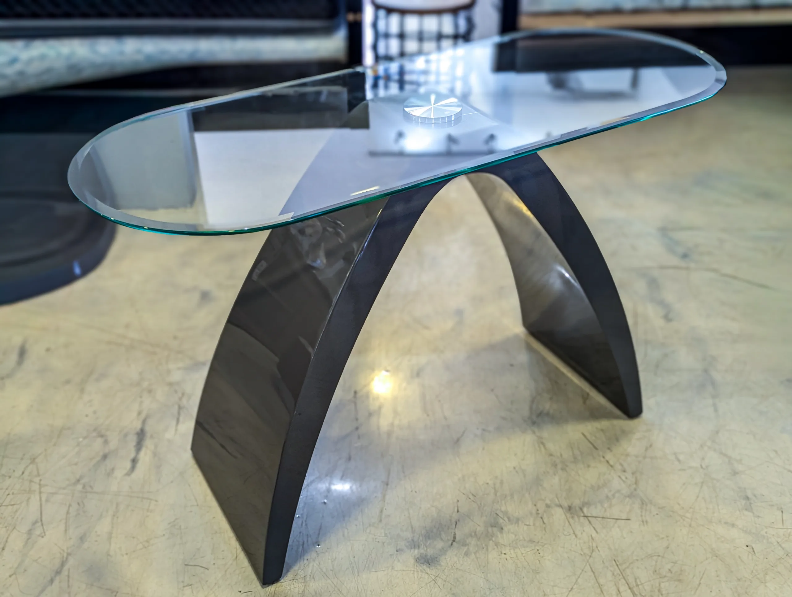 Oval Glass Coffee Table – Contemporary Clear Glass Table with Sculptural Curved Dark Base