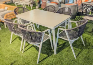 7-Piece Outdoor Patio Dining Set – White Slatted Table with 6 Gray Rope-Woven Armchairs